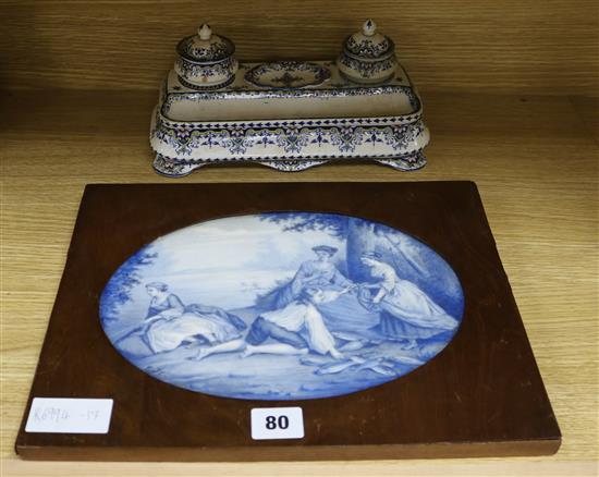 A Gien faience desk stand and a delft plaque